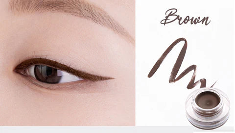 Eyebrow pencil with brown color swatch applied to eye and product container on white background